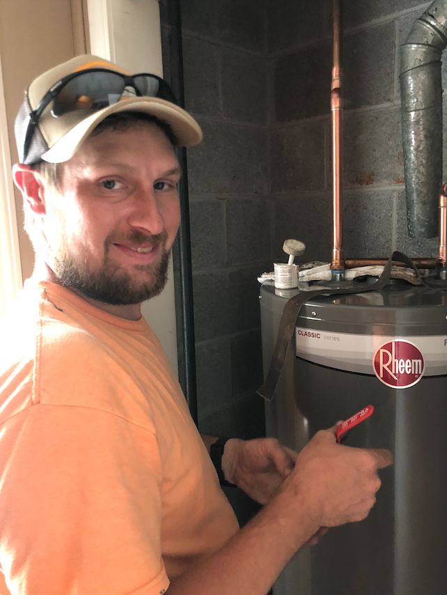 Mac-Plumbing-Heating-Air-Adam-works-on-new-hot-water-heater-in-clarksville-tn
